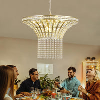 24' Modern Crystal Round Chandelier with Gold Finish elegantly illuminating a dining room, surrounded by people enjoying a meal.