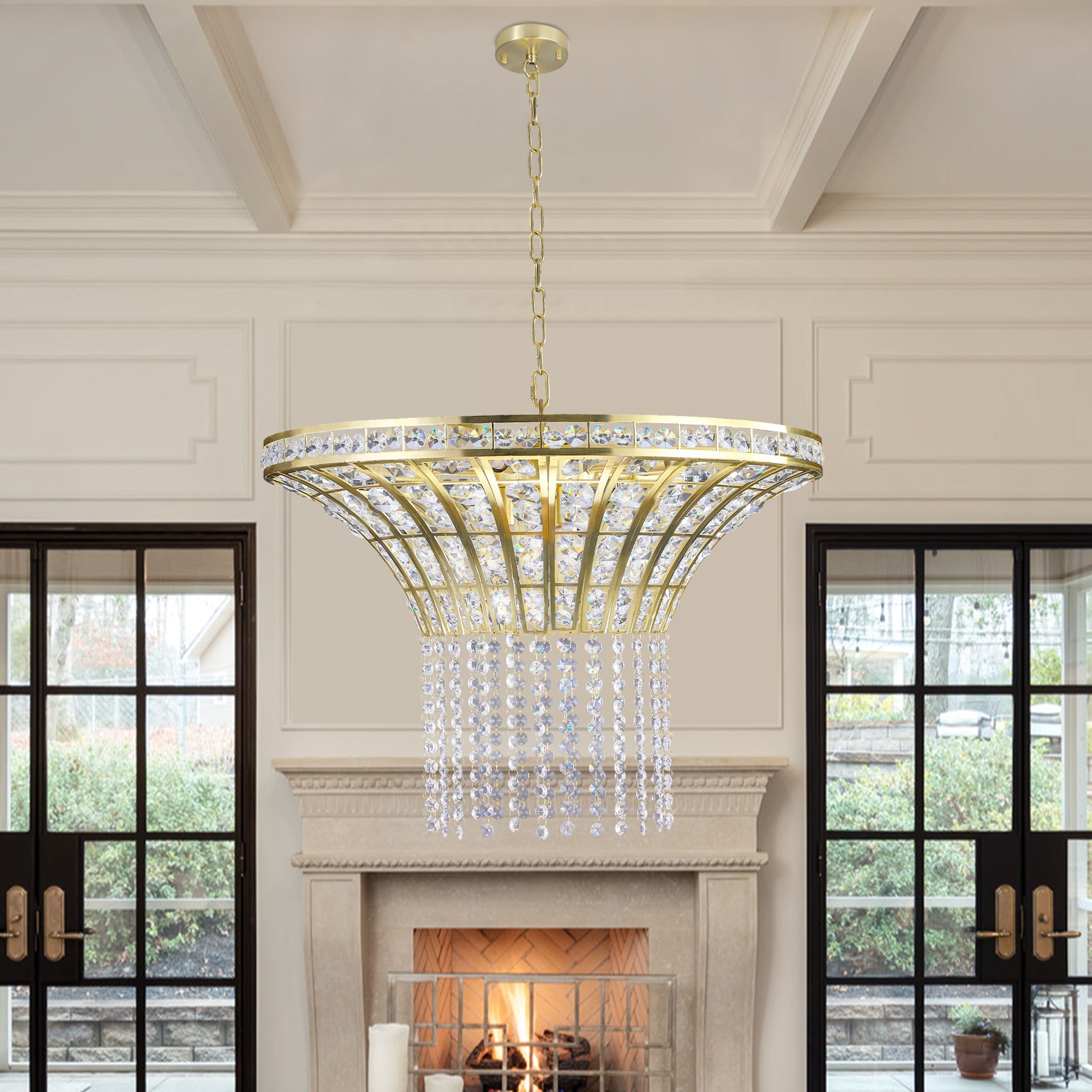 24' modern crystal round chandelier with gold finish, elegant pendant light hanging in a stylish living room over a fireplace.